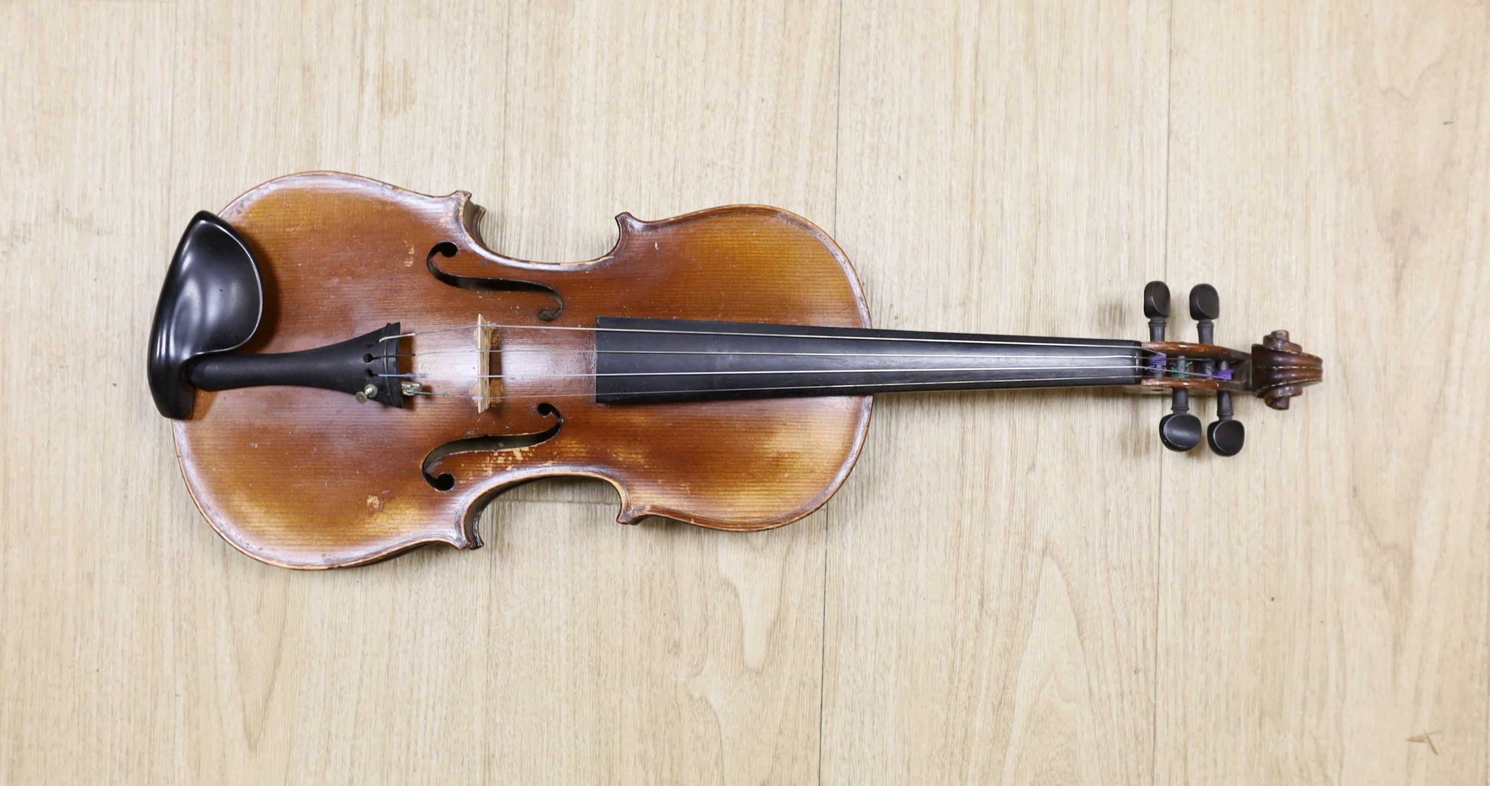 A cased violin, back 36cm, with bow